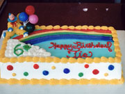 Custom Cake with Clown, Balloons, and Rainbow
