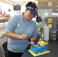 Cake decorator making sponge bob cake